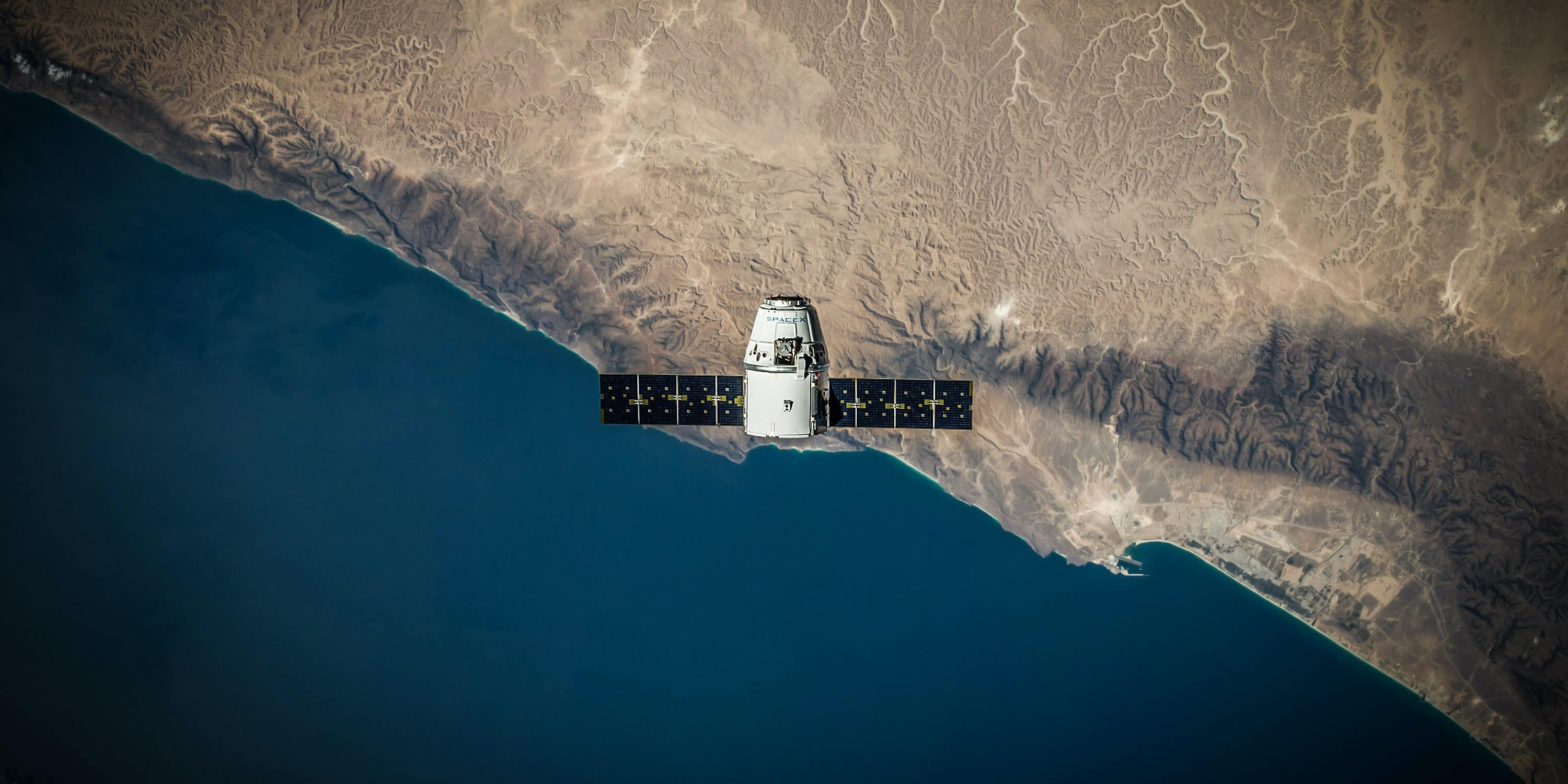 Image looking down from space of a satellite over the earth