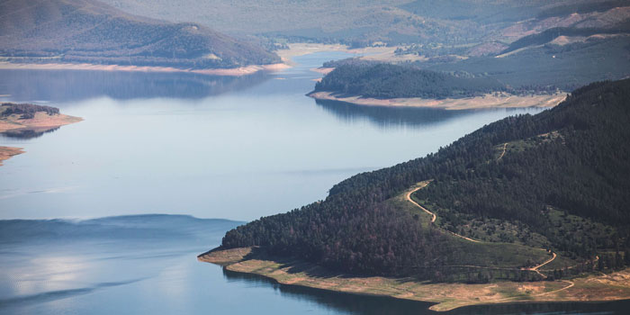 Shoreline of a large lake showing water next to land.