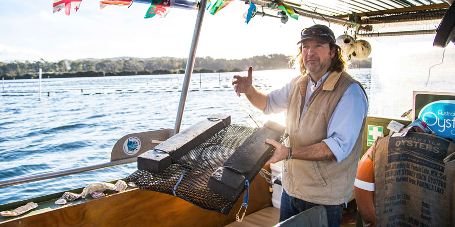 Oyster tour guide on his boat speaking