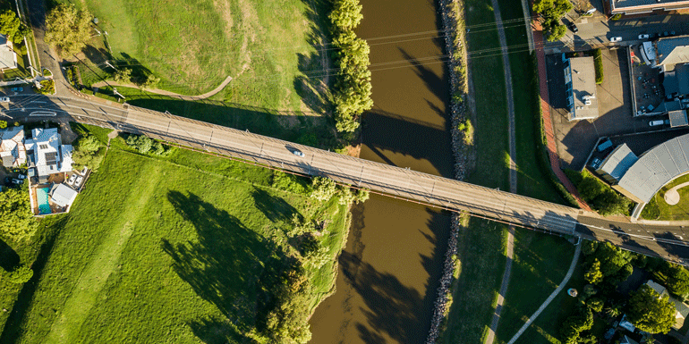 Aerial photograph of a road bridge over a river. 