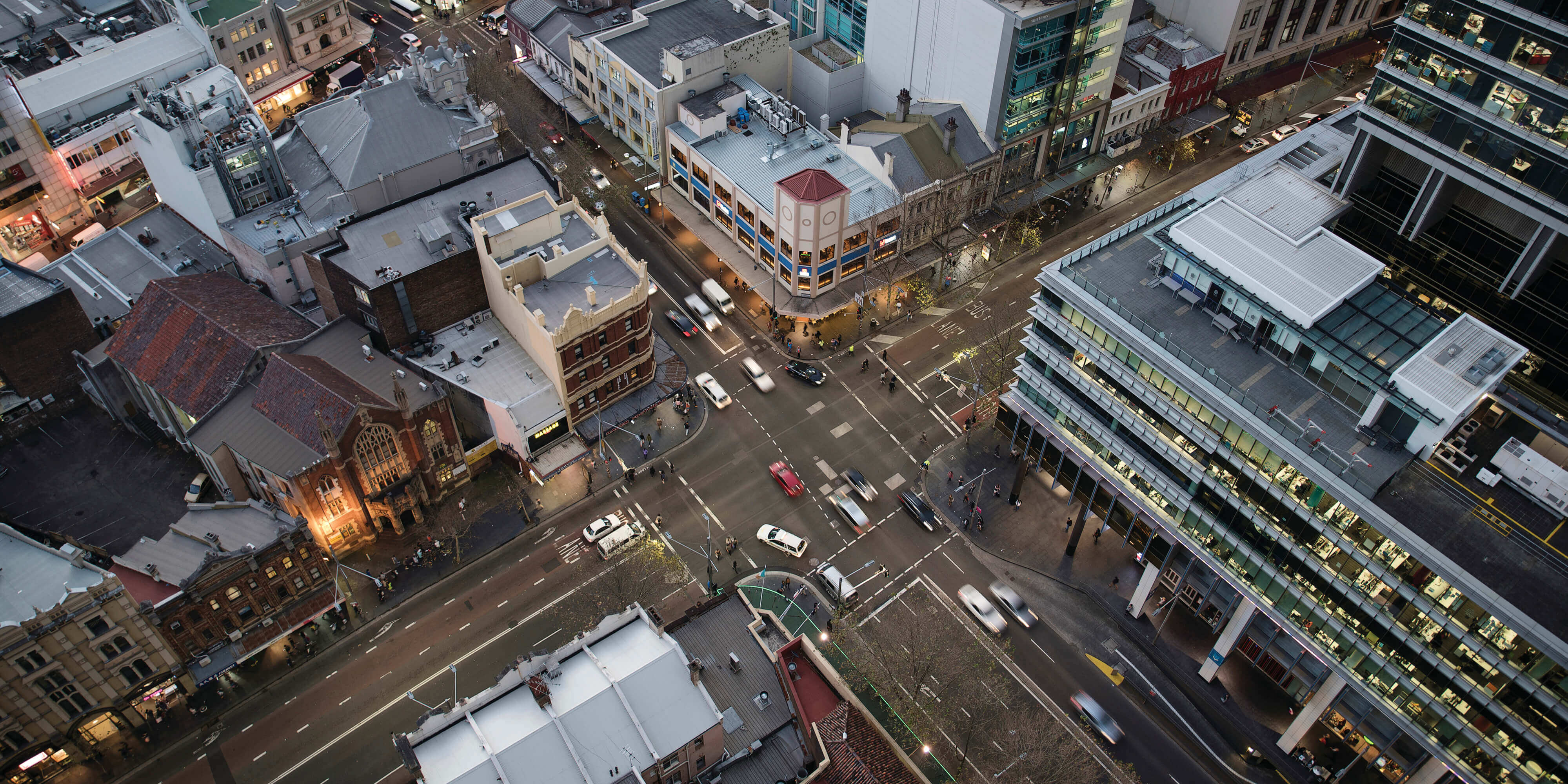 Aerial view of Sydney CBD with buildings and water.