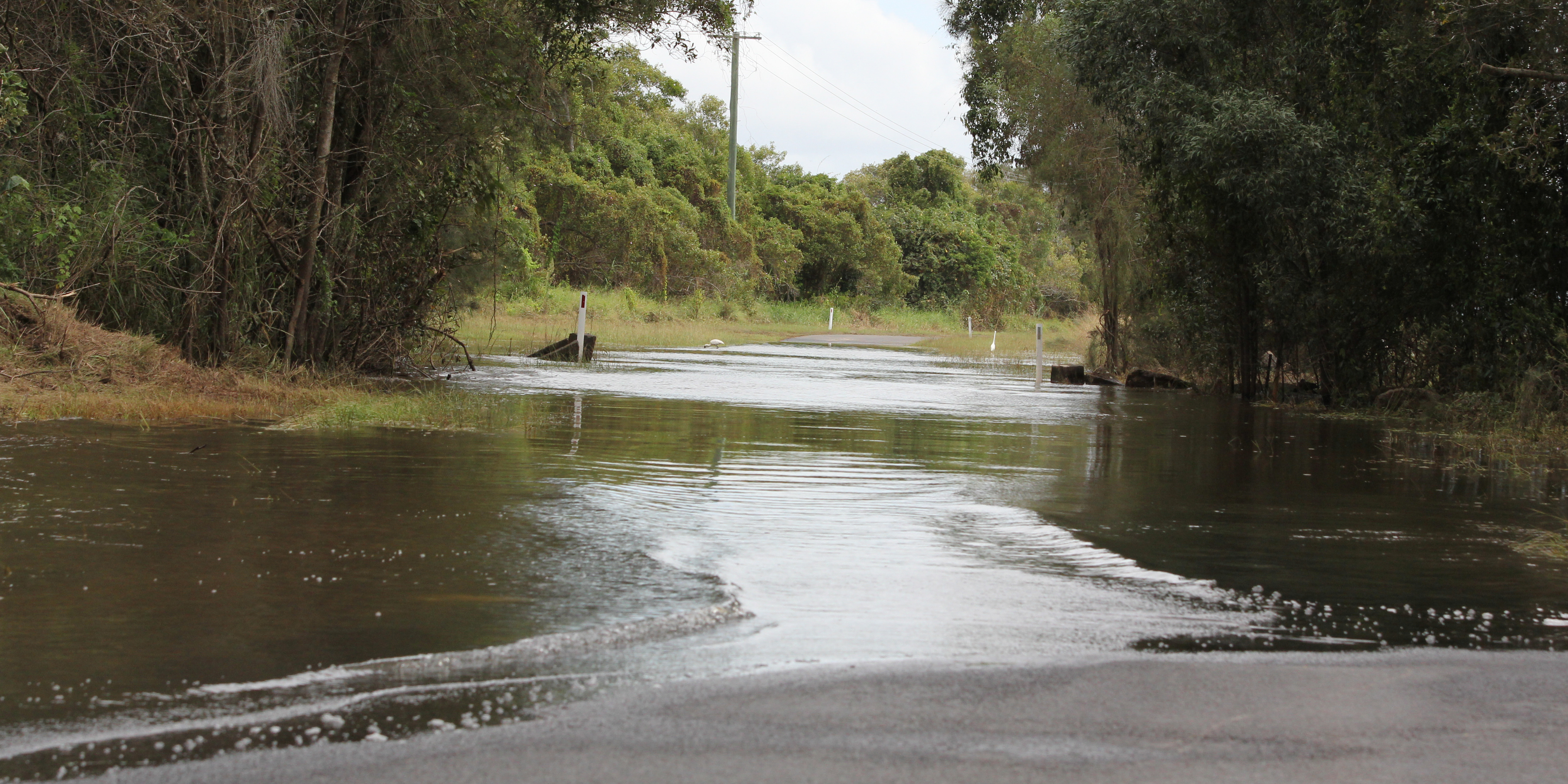 Floodwaters over Ashby Ferry Road in northern NSW.