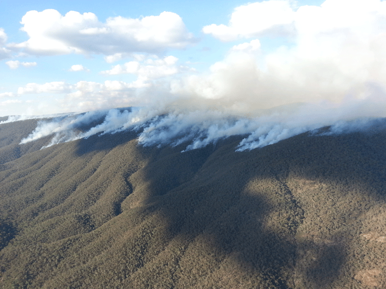 Aerial incendiary hazard reduction smoke plume in Brindabella National Park. 
