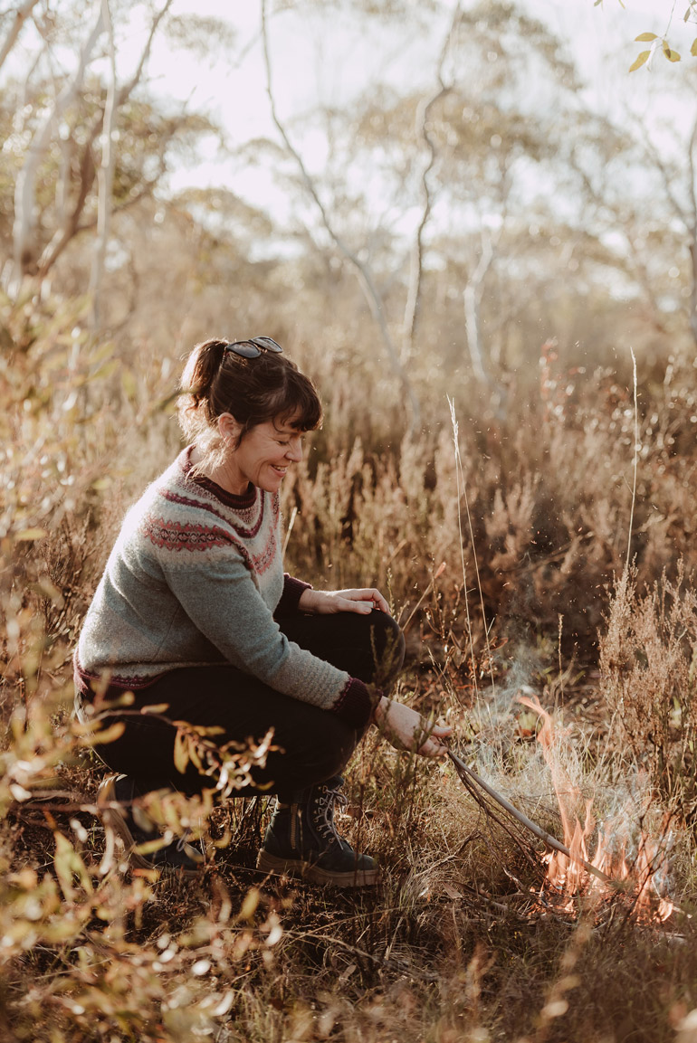 woman crouched down cool burning