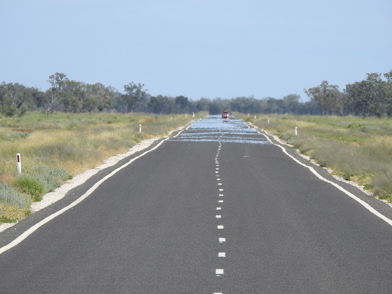 Heat ripples rise from the road in the Brewarrina region of NSW